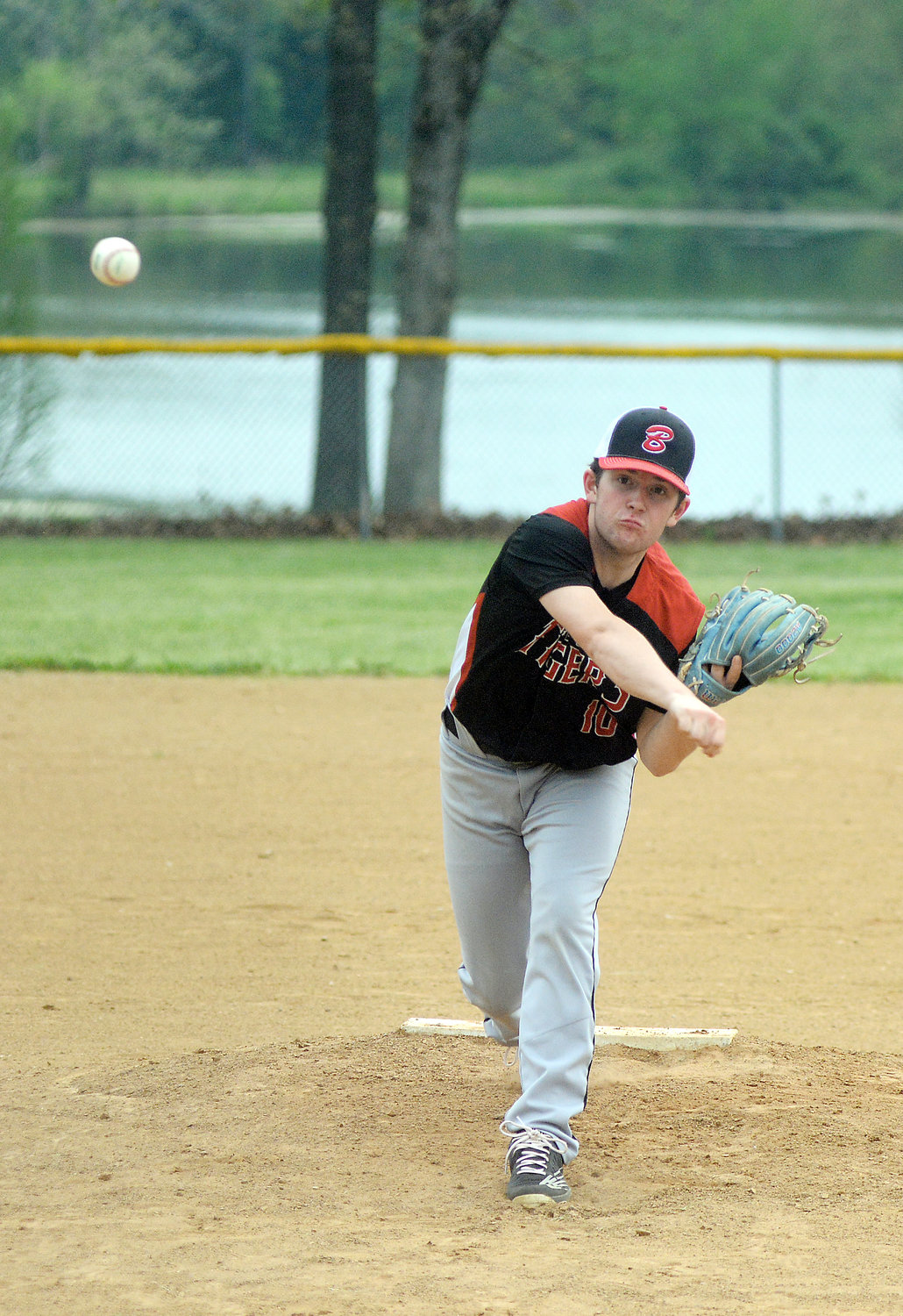 Kameron Newton lets one of his 72 pitches fly for Bryce Gehlert’s Belle Tigers during their 9-6 victory in their regular season finale. Newton picked up the victory while senior Kale Loughridge pitched the seventh inning in relief of Newton.